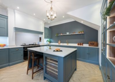 Stylish blue and white kitchen with breakfast bar island